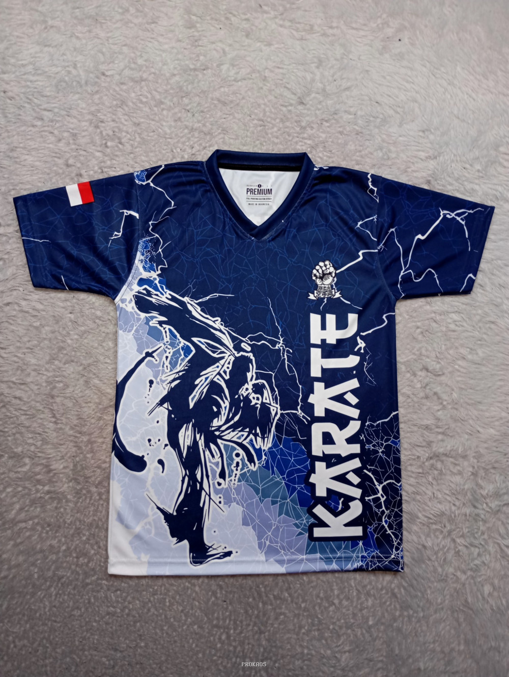Jersey Karate Biru Gelap dengan Desain Petir dan Ilustrasi Atlet - Jersey Custom PROKAOS